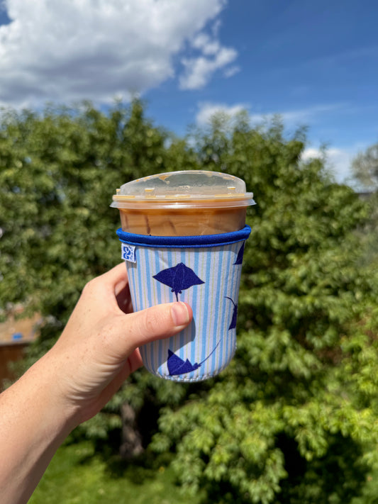 &BEYOND Eagle Ray iced coffee coozie featured outdoors.