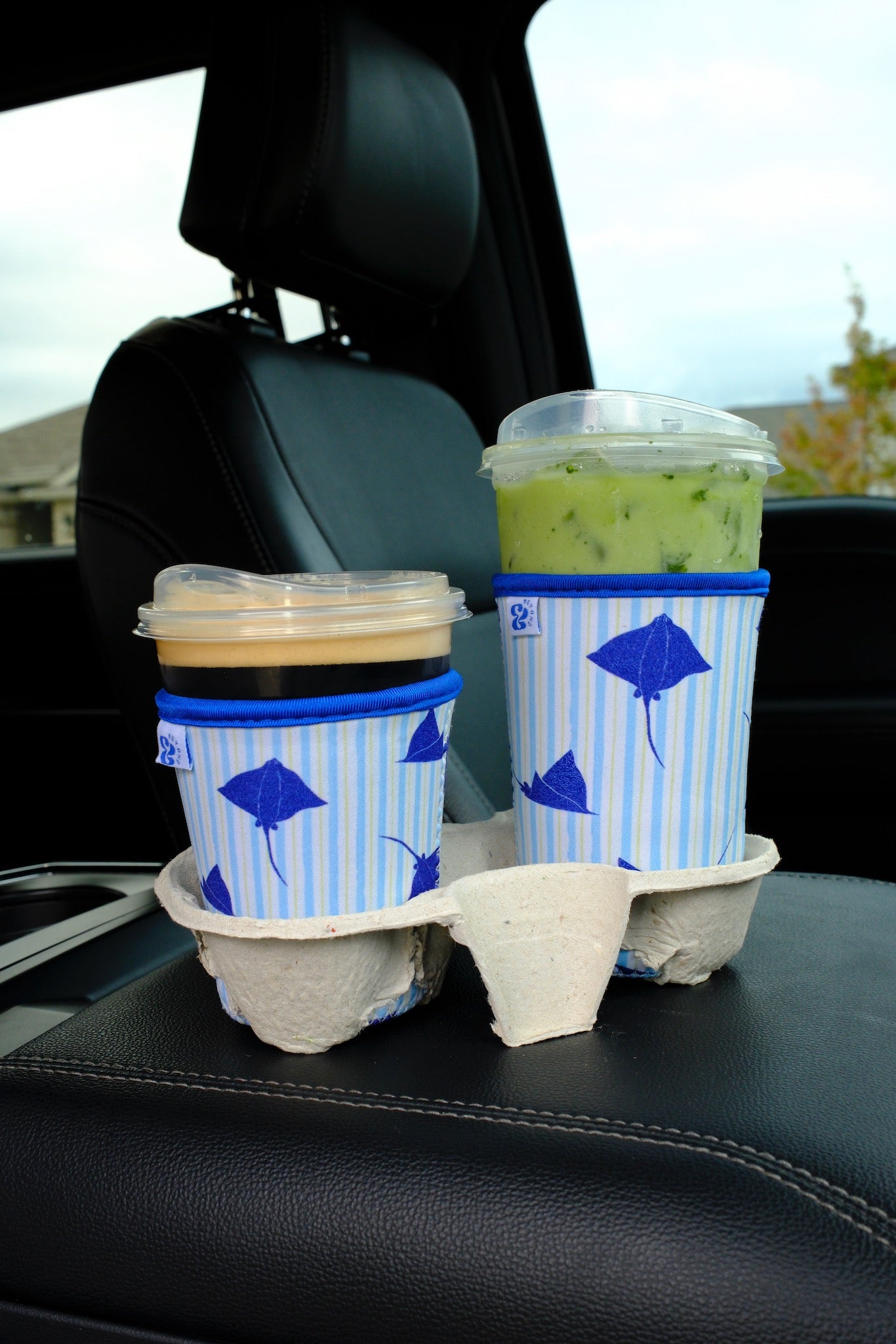 Close-up showing the texture and hand-printed Eagle Ray design on the &BEYOND coozie.