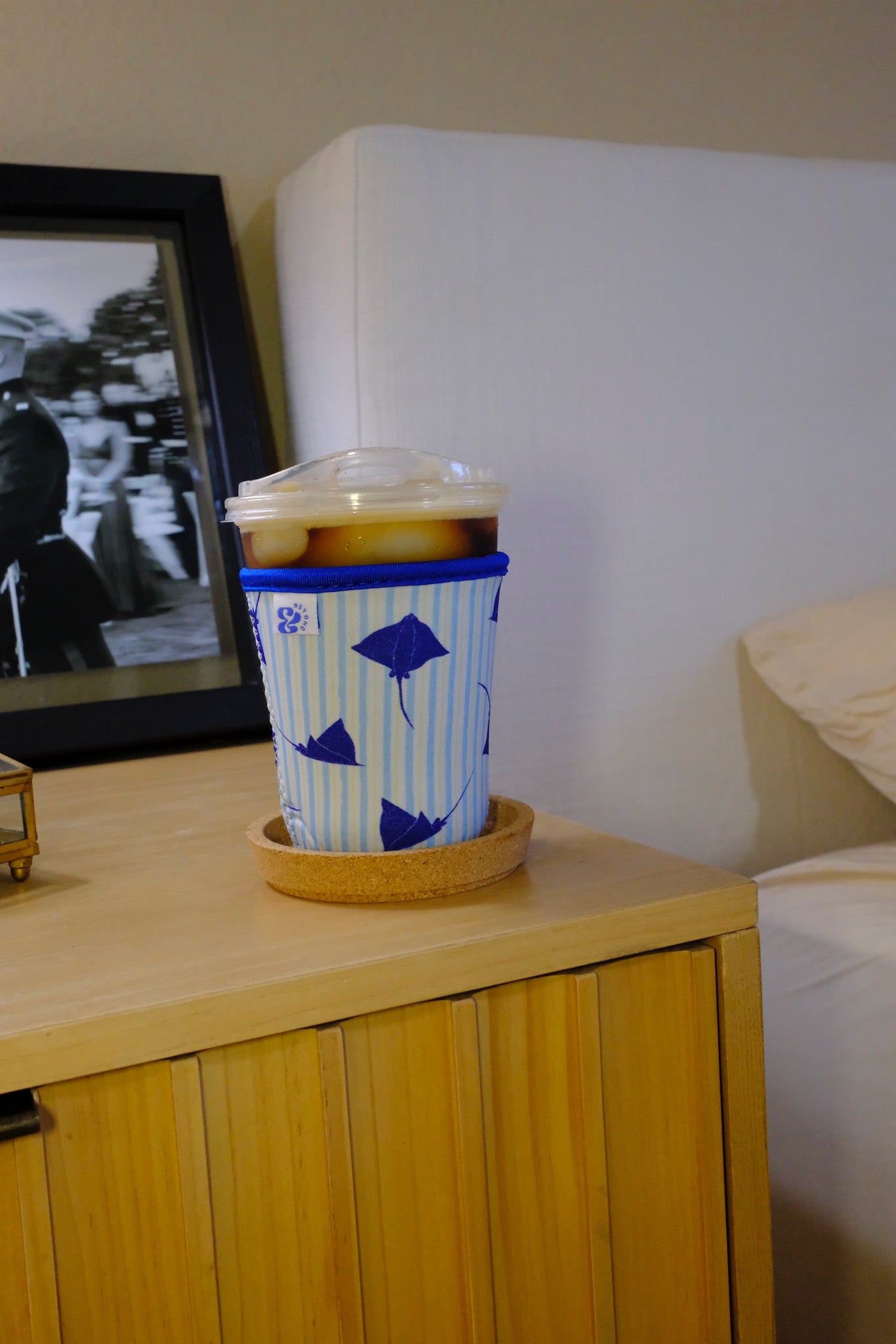 &BEYOND Eagle Ray coozie styled on a kitchen countertop with everyday items.