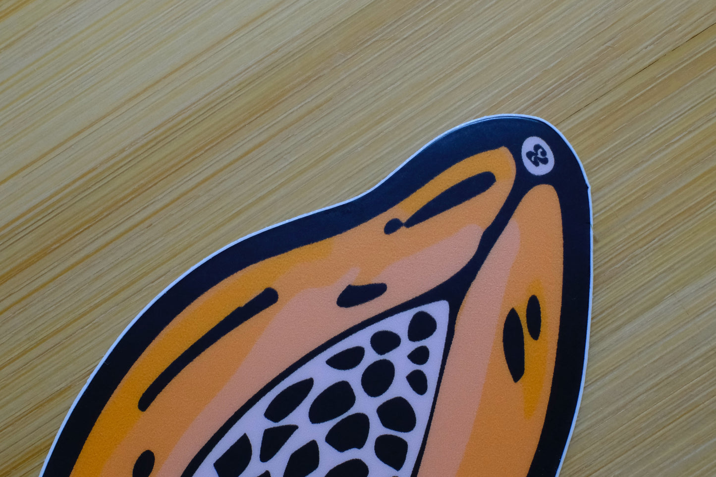Close-up of the &BEYOND Papaya sticker showing crisp illustration detail.